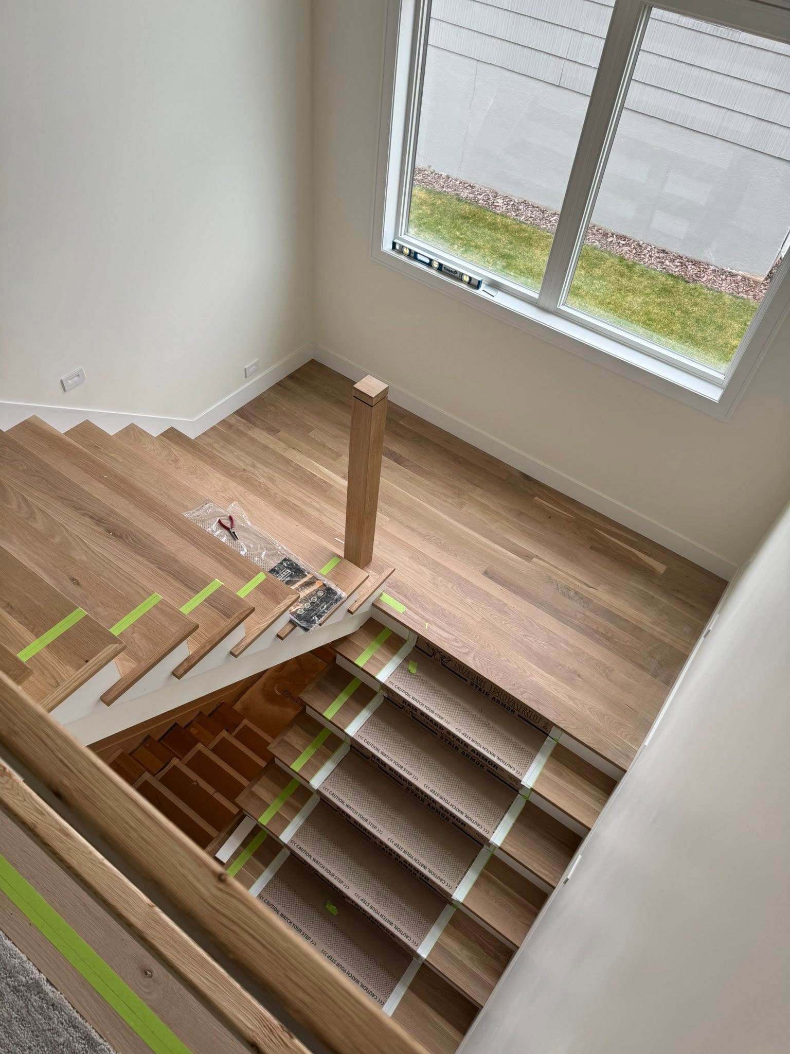 New white oak hardwood flooring and staircase in a modern home