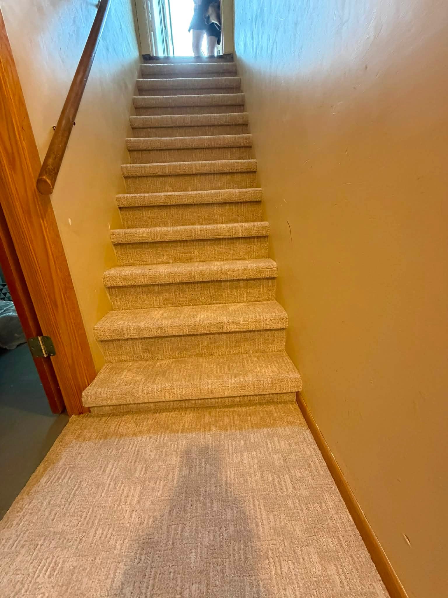 Textured beige carpet installed on a staircase